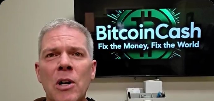 Steve Thurmond speaking to camera in front of a BitcoinCash screen reading Fix the Money, Fix the World