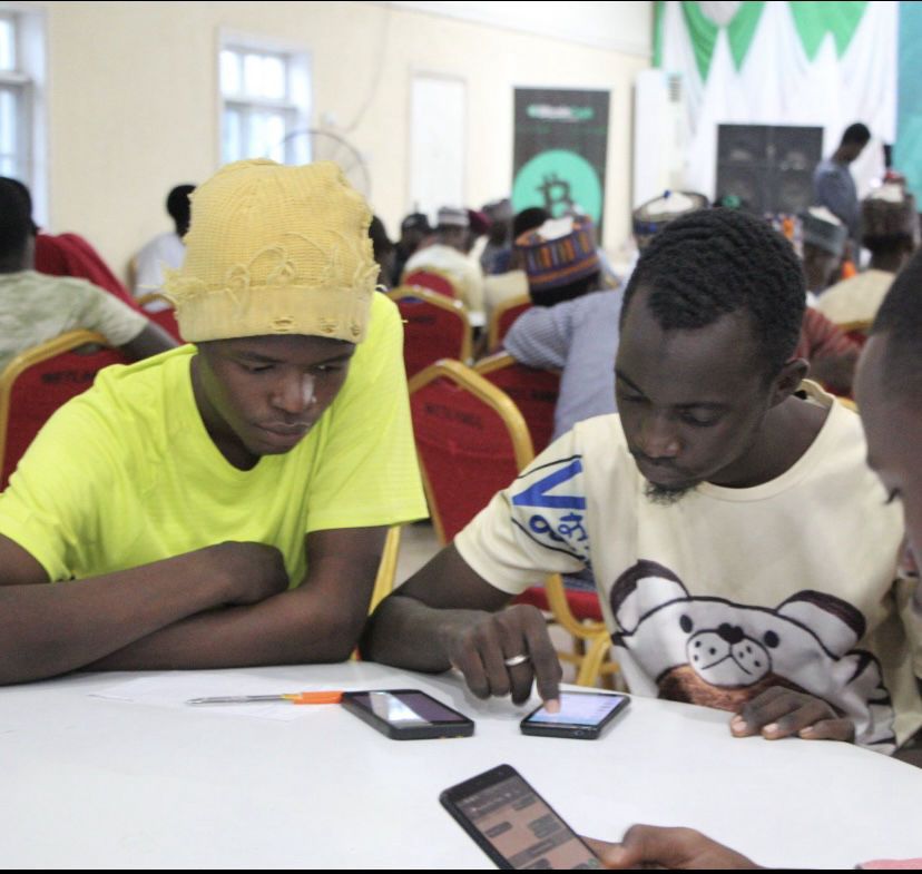 Participants working at a table with phones